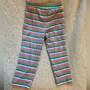 Striped green, pink, blue, green, grey, and white tights